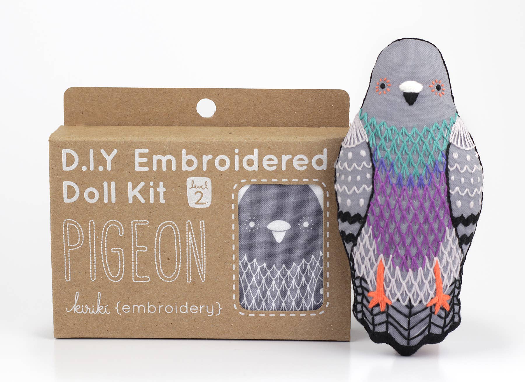 The finished Kiriki Press pigeon doll, about 4.5 inches tall, embroidered and stuffed
