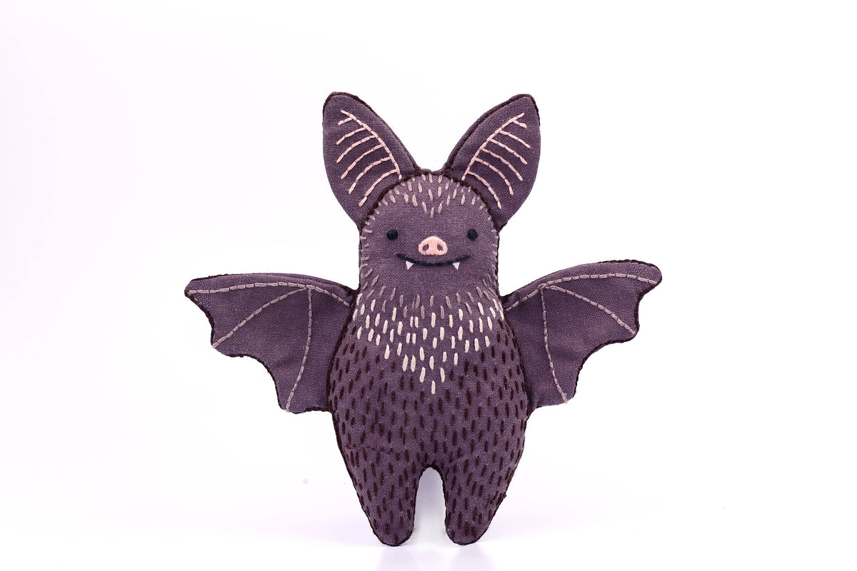 The finished Kiriki Press bat doll, about 4.5 inches tall, embroidered and stuffed