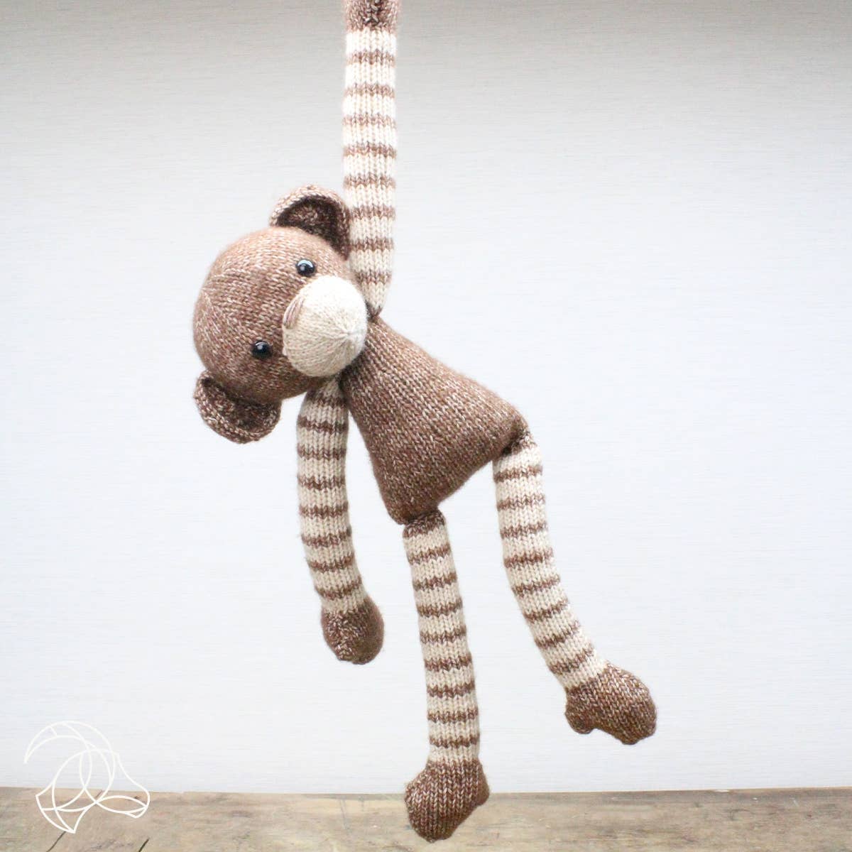 Malinda Monkey knitted amigurumi with long arms and legs