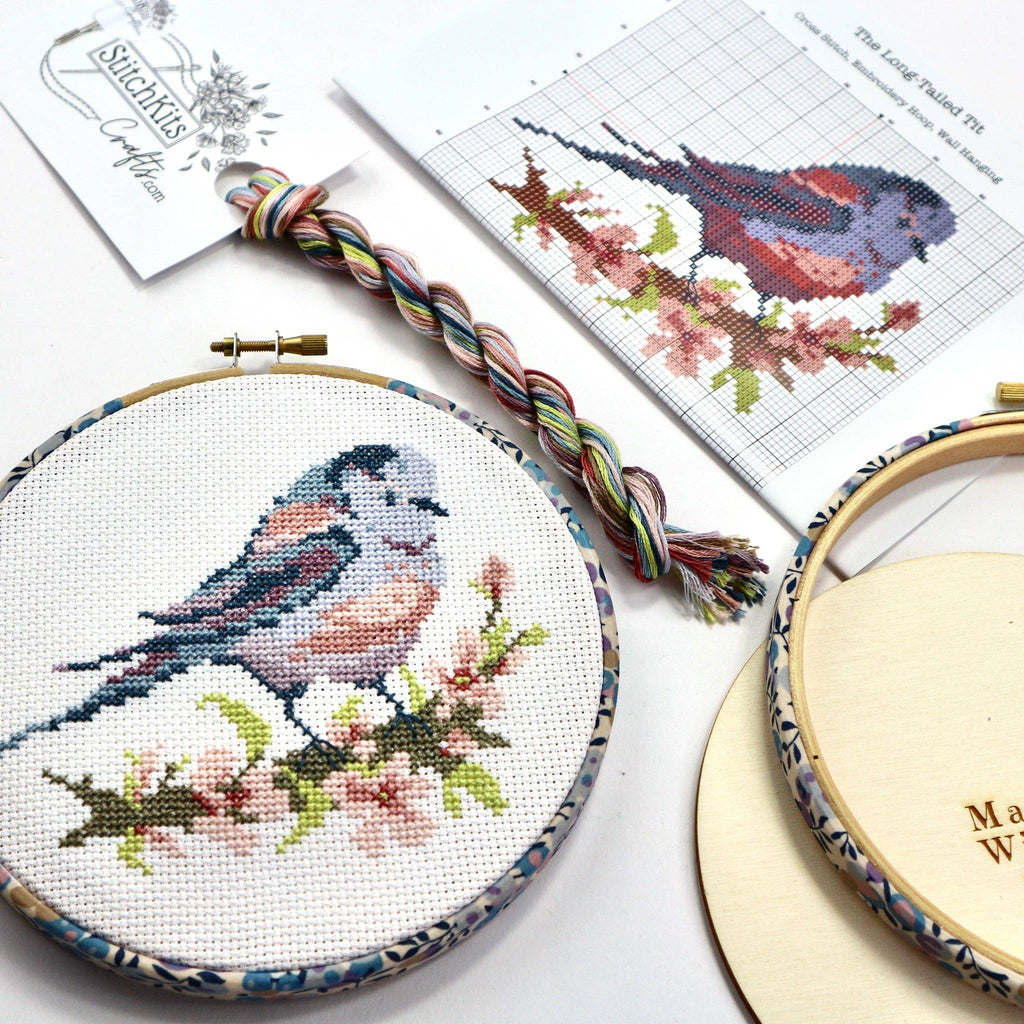 Long-tailed Tit cross stitch kit packaging, listing the chart, aida, threads, needle and wooden back