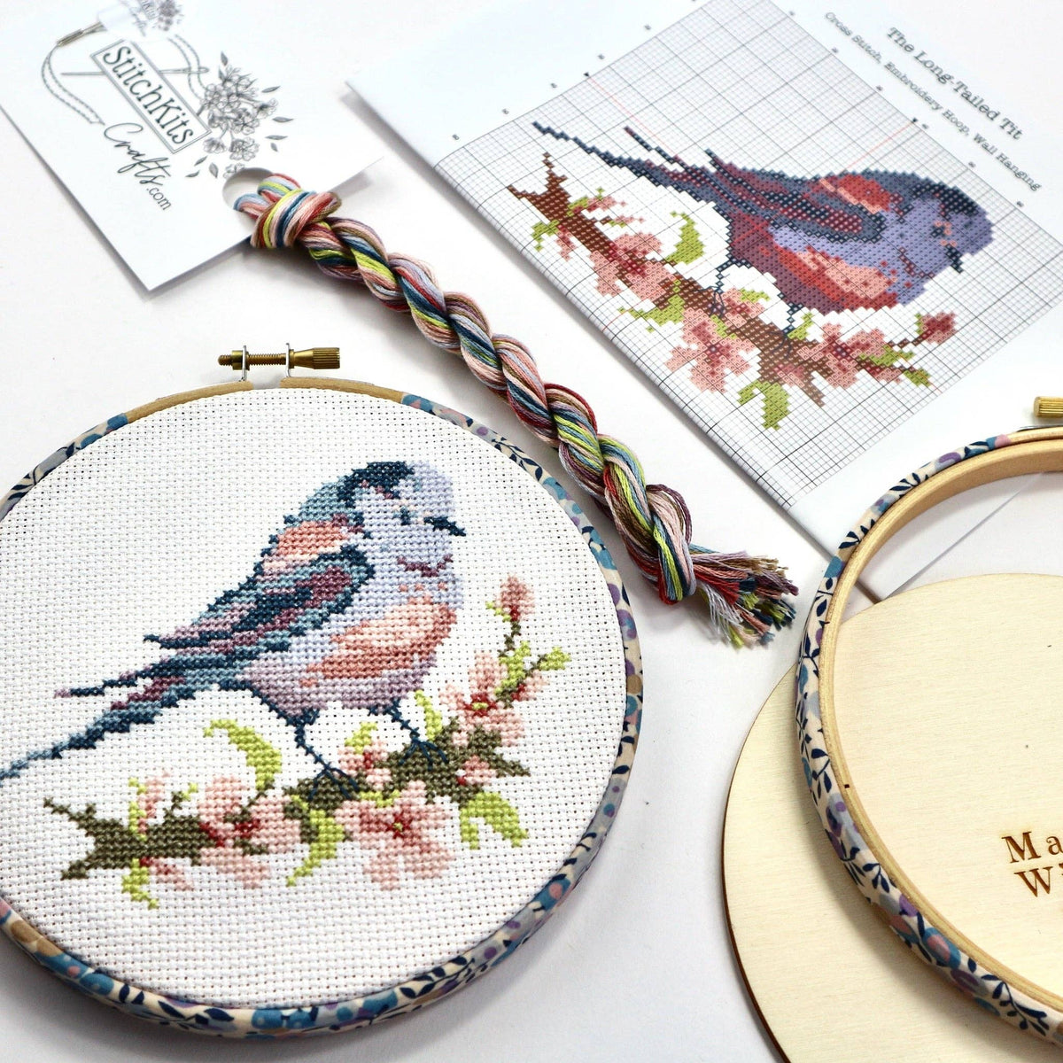 Long-tailed Tit cross stitch kit packaging, listing the chart, aida, threads, needle and wooden back