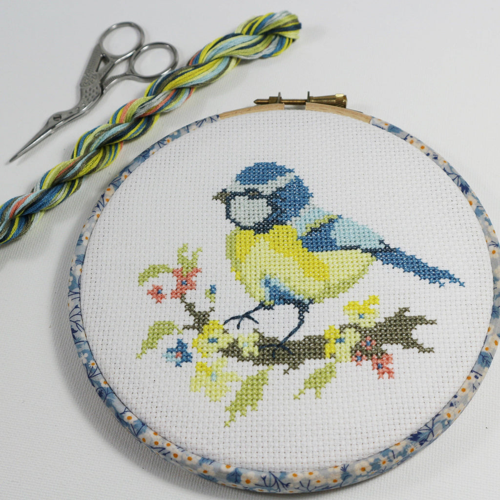 The Blue Tit design worked on 14 count cotton aida, a blue tit on yellow blossom