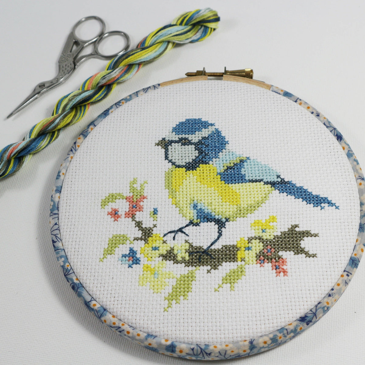 The Blue Tit design worked on 14 count cotton aida, a blue tit on yellow blossom