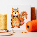 Mandala Squirrel counted cross stitch kit by Meloca Designs in shades of orange and brown