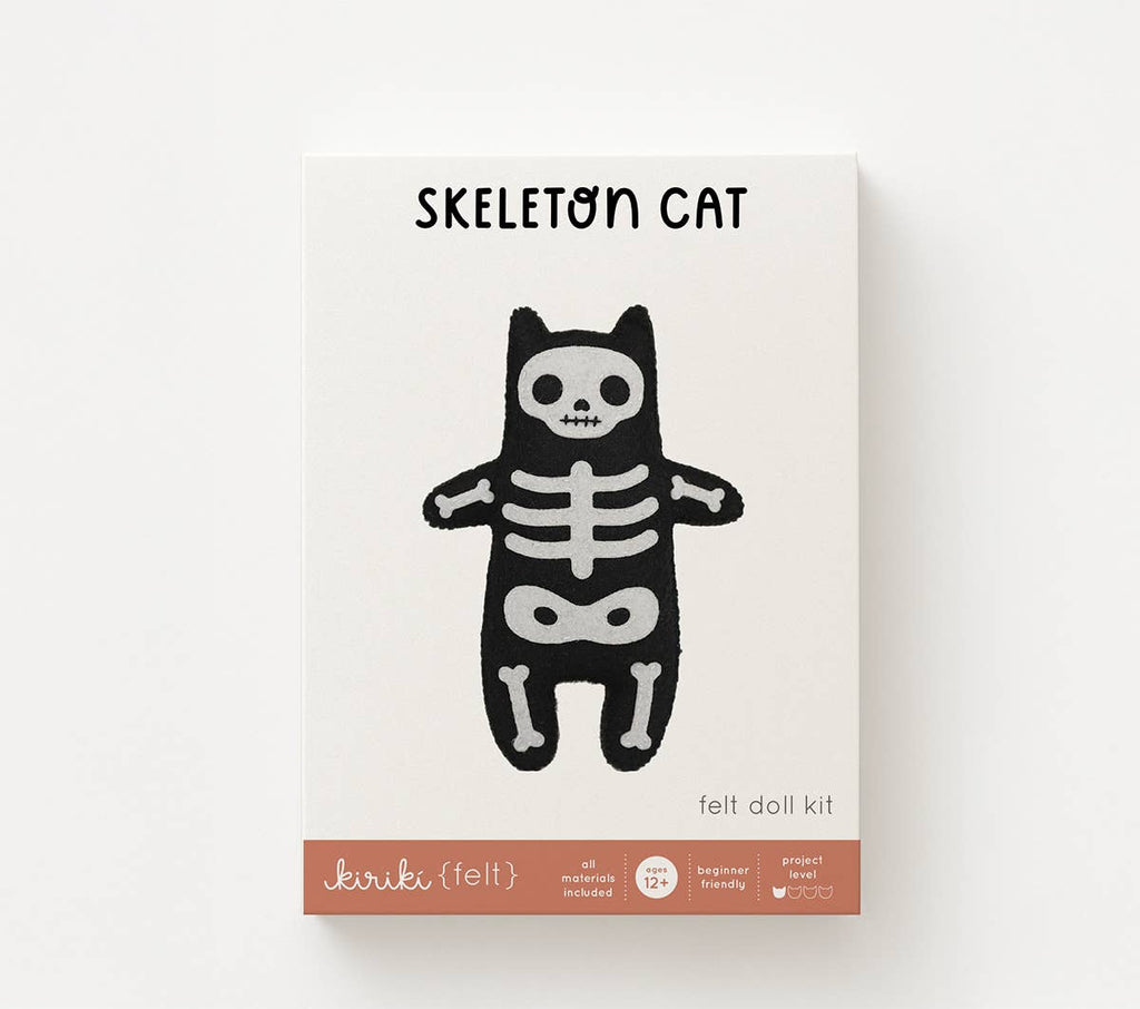 Skeleton Cat felt doll kit in its screen printed Kiriki Press packaging