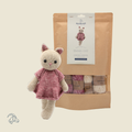Knitted Emma Cat amigurumi in beige and pink marbled yarn