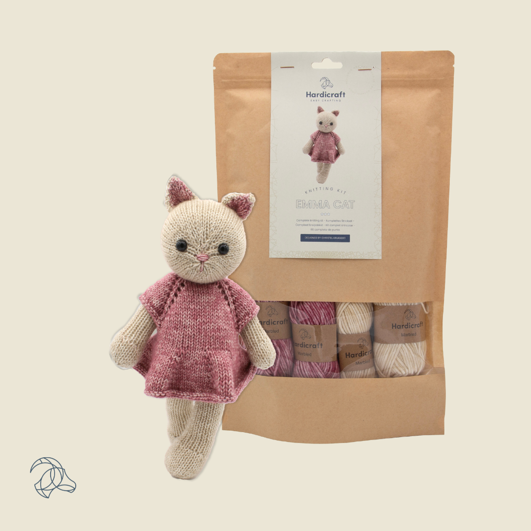 Knitted Emma Cat amigurumi in beige and pink marbled yarn
