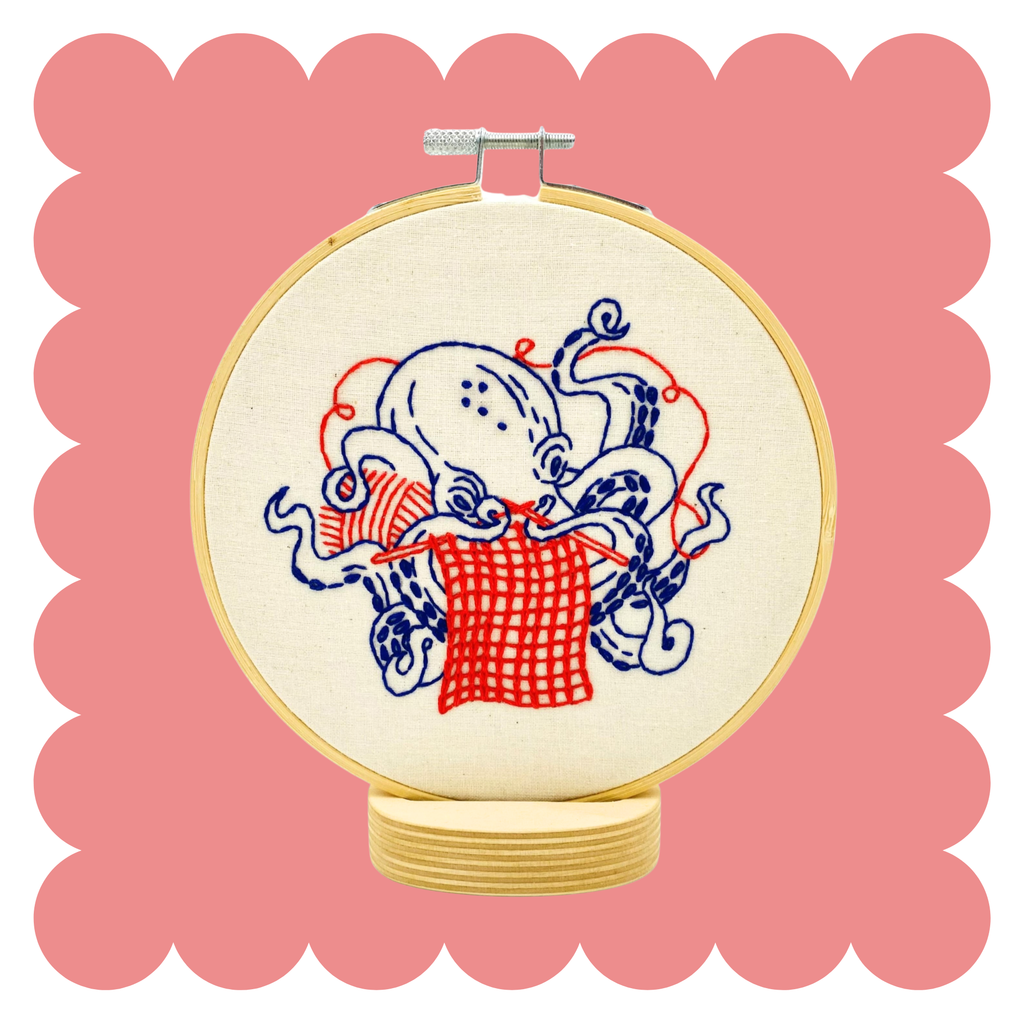 Knitting octopus embroidery design on unbleached cotton in a hoop