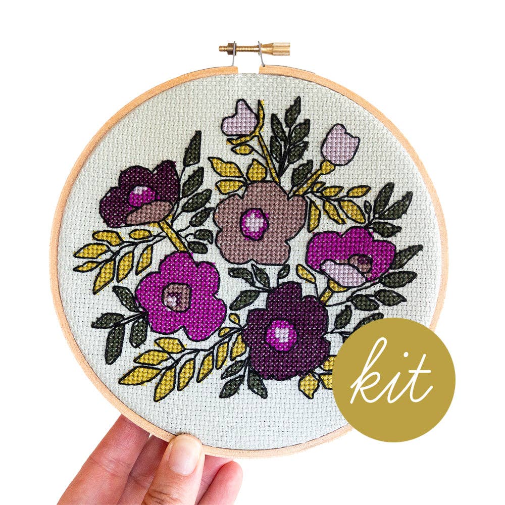Violet Vibes cross stitch kit by Junebug and Darlin, purple floral design on sage green cloth