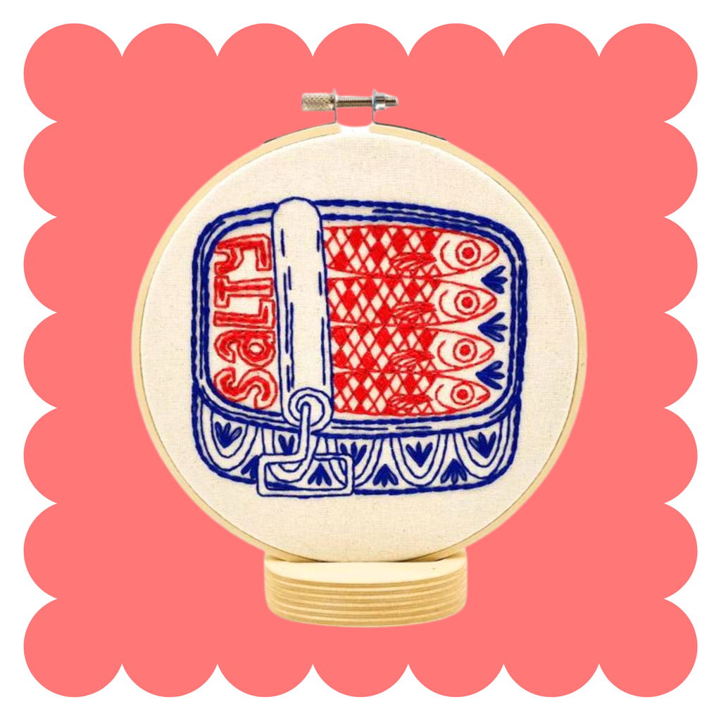 Sardines embroidery design on unbleached cotton in a hoop