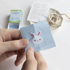 Kawaii bunny rabbit cross stitch design on 14 count Aida