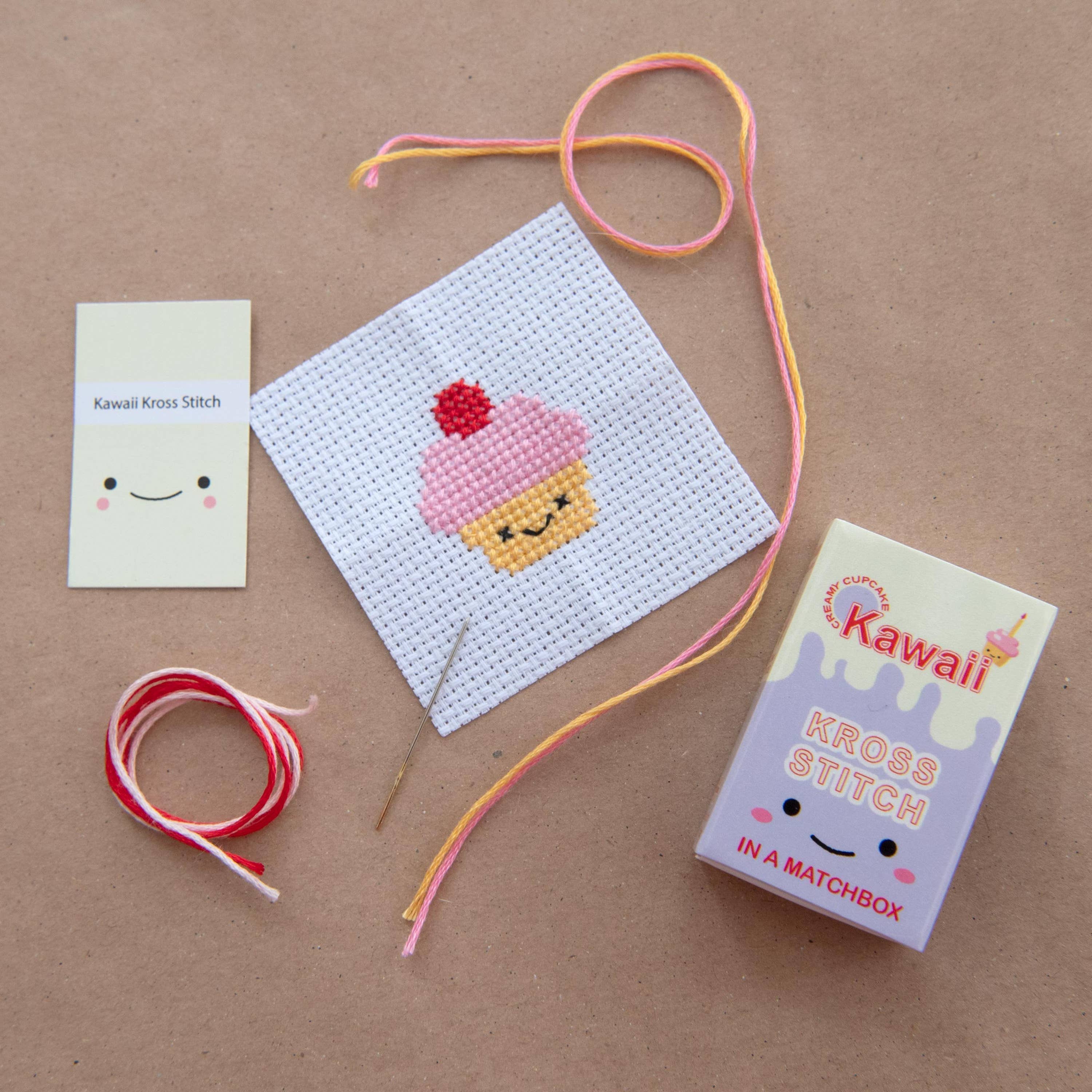 Kawaii cupcake cross stitch design on 14 count Aida