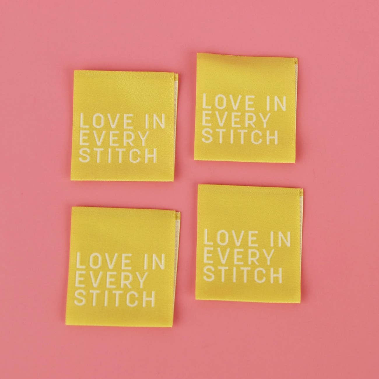Love in Every Stitch single sided sew-in label in chartreuse on woven polyester