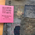 Stick the transfer over the hole, stitch the pattern, rinse the paper away