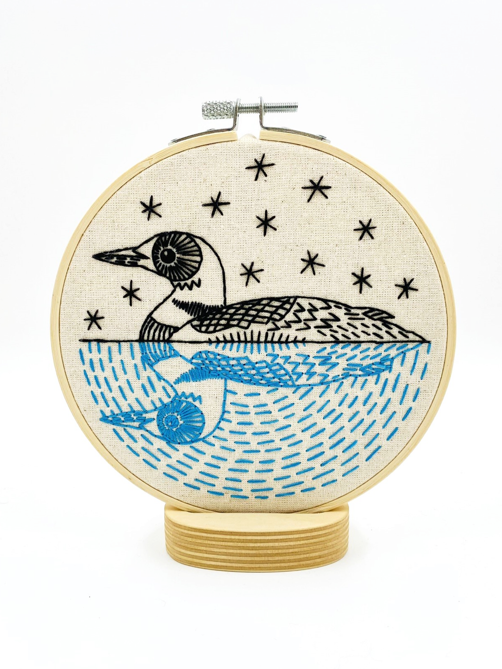Loon embroidery kit contents including hoop, floss and needle