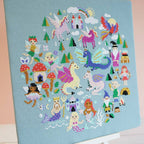 The Enchanted Realms design, 10.5 inches square, worked in 15 DMC shades on green aida