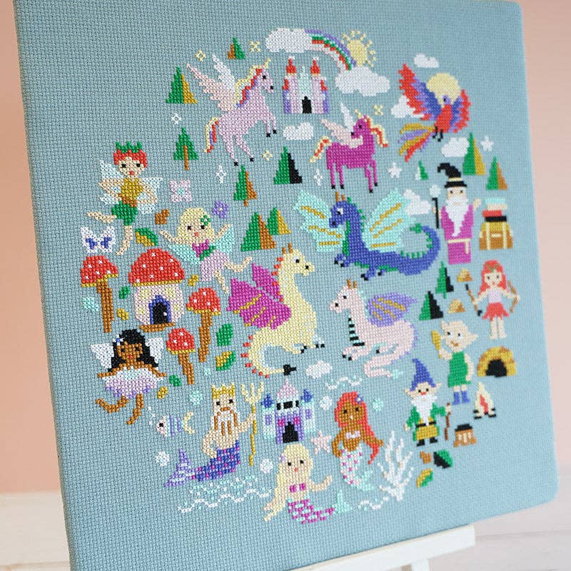 The Enchanted Realms design, 10.5 inches square, worked in 15 DMC shades on green aida